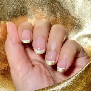 Gold nail polish design.