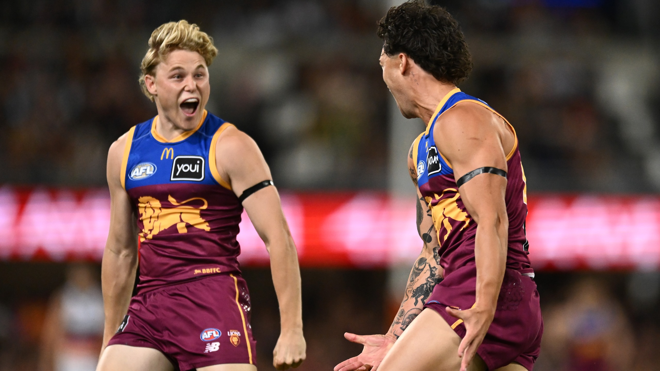 Cam Rayner of the Lions celebrates with Levi Ashcroft of the Lions after kicking a goal during the AFL Semi Final match between Brisbane Lions and Adelaide Crows