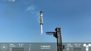 The first-stage Super Heavy booster of SpaceX's Starship megarocket comes back for a catch at its launch tower during the vehicle’s eighth test flight on March 6, 2025.