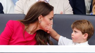 Prince Louis covers his mother Princess Catherine's mouth with his hand