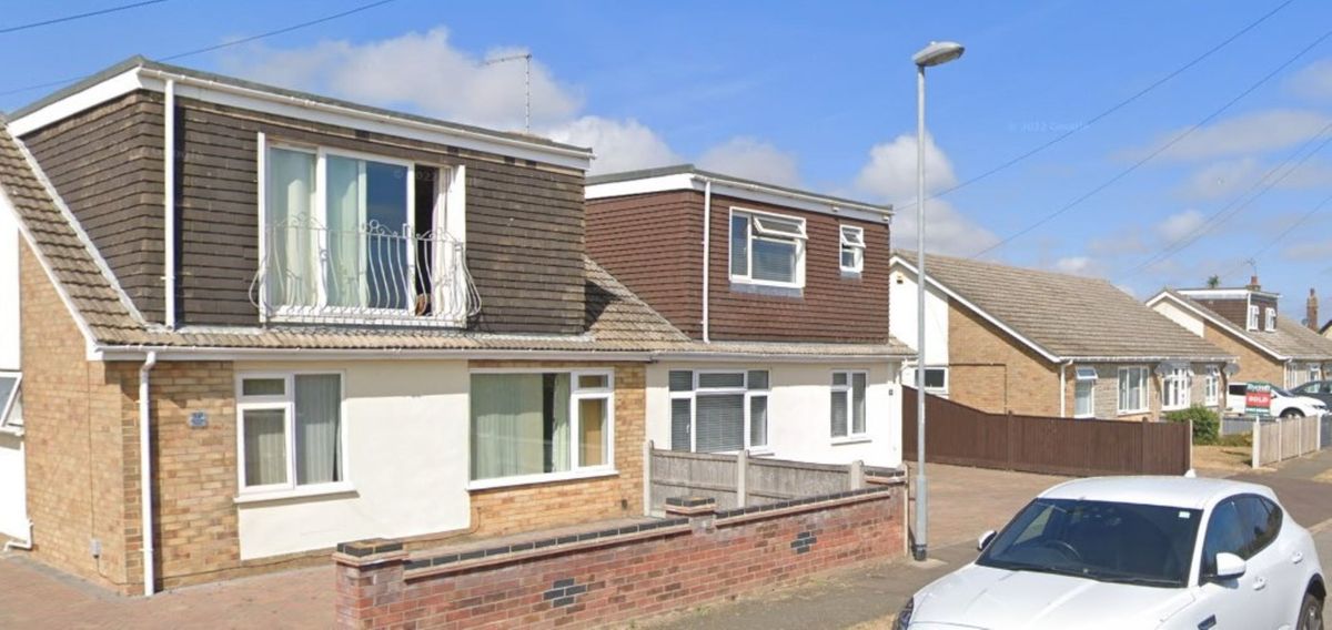 A row of bungalows with some having dormer lofts and some not