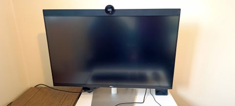 A Dell UltraSharp U3223QZ monitor sitting on a desk