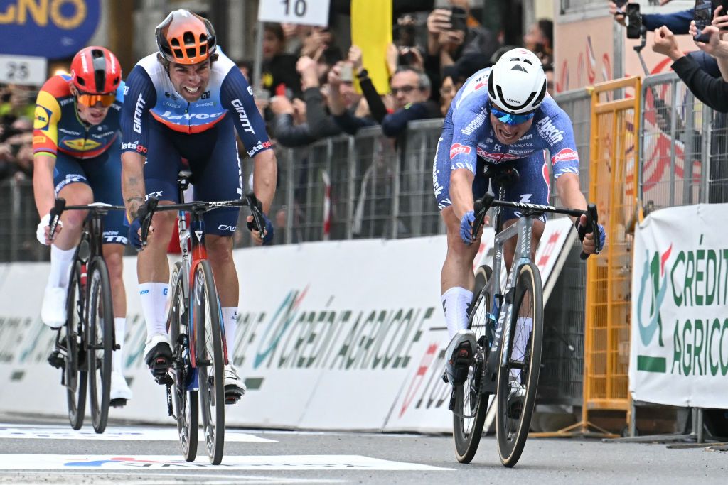 Alpecin-Deceuninck&#039;s Belgian rider Jasper Philipsen (R) cycles to cross the finish line ahead of Team Jayco Alula&#039;s Australian rider Michael Matthews (C) during the 115th Milan-SanRemo one-day classic cycling race, between Pavia and SanRemo, on March 16, 2024. (Photo by Marco BERTORELLO / AFP)