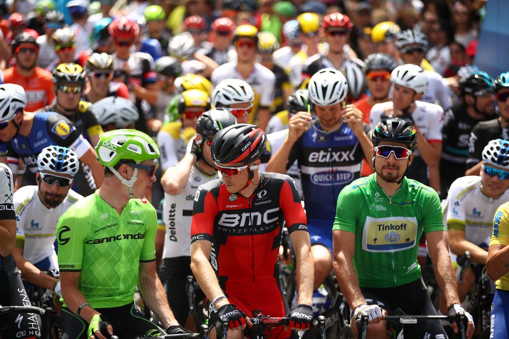 Ben King and Rohan Dennis chat on the start line before the final stage