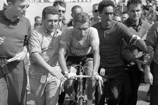12/7/1964 Tour de France 1964.Stage 20 - Brive to Clermont Ferrand.Jacques Anquetil is helped away at the finish after struggling up the summit of Puy de Dome.Photo: Offside / L'Equipe.