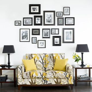 white wall with photo and sofa