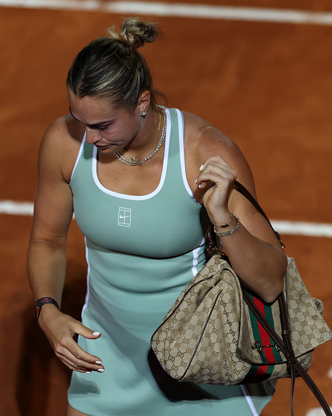 Aryna Sabalenka carrying a Gucci Paparazzo bag at the Italian Open in Rome.