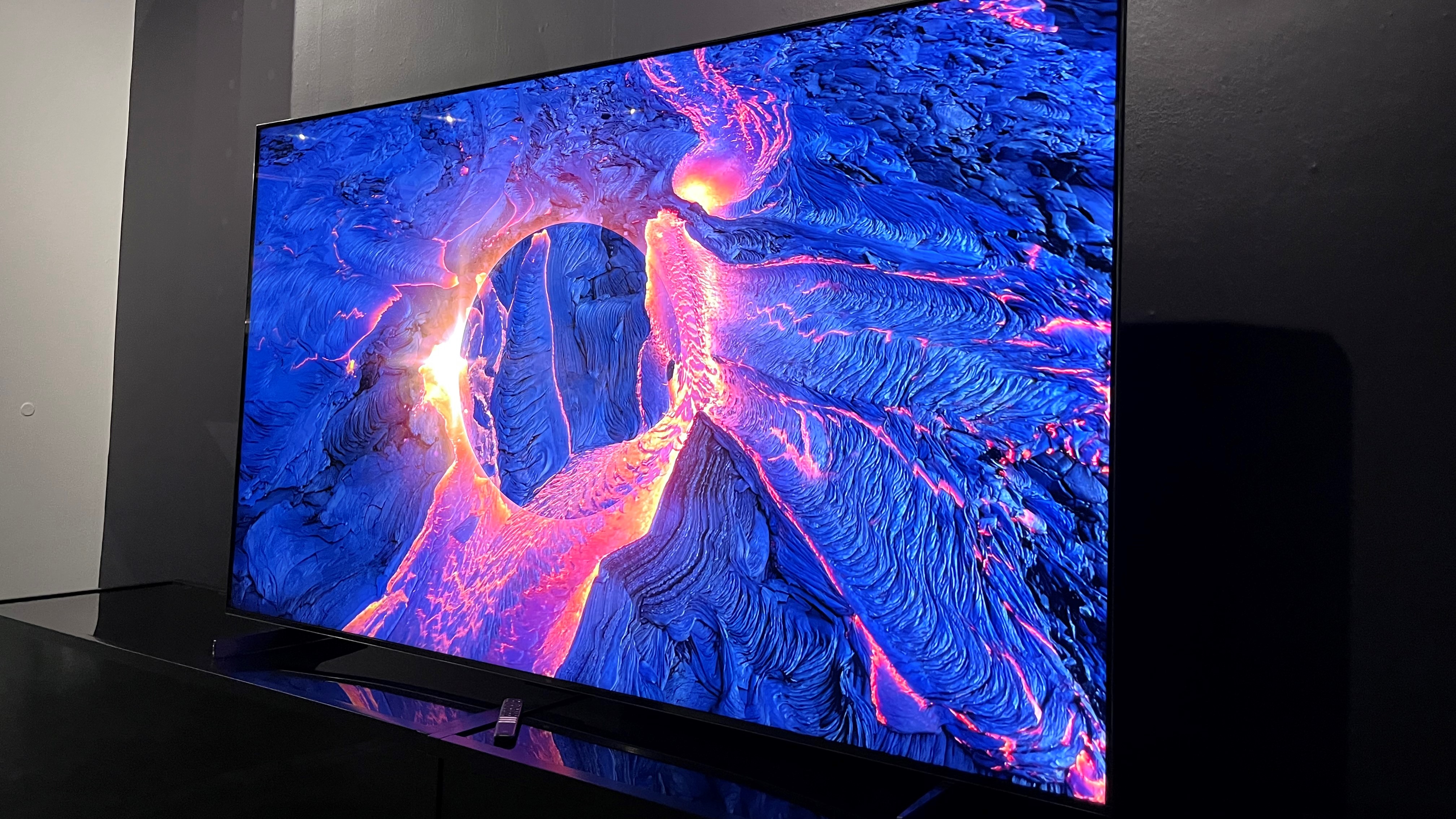 TCL QM8 Series TV showing abstract image
