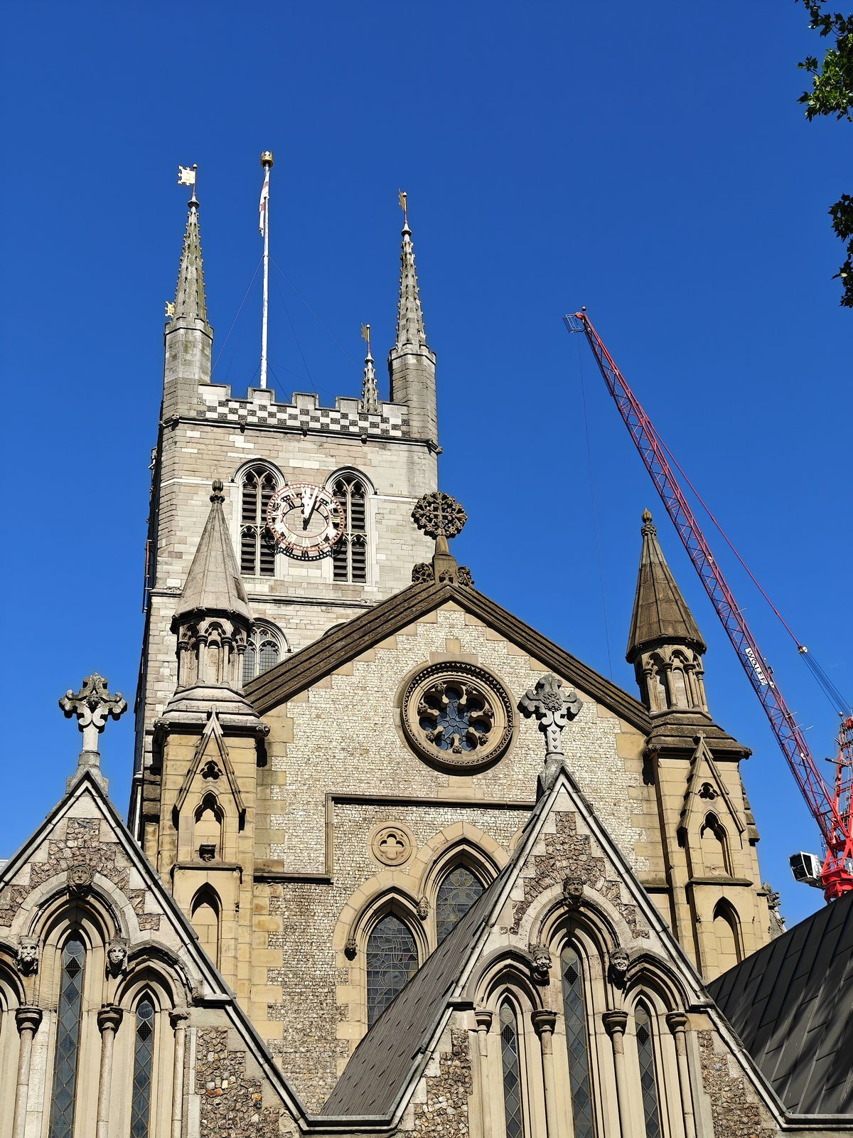 Church spires rising in front of a blue sky