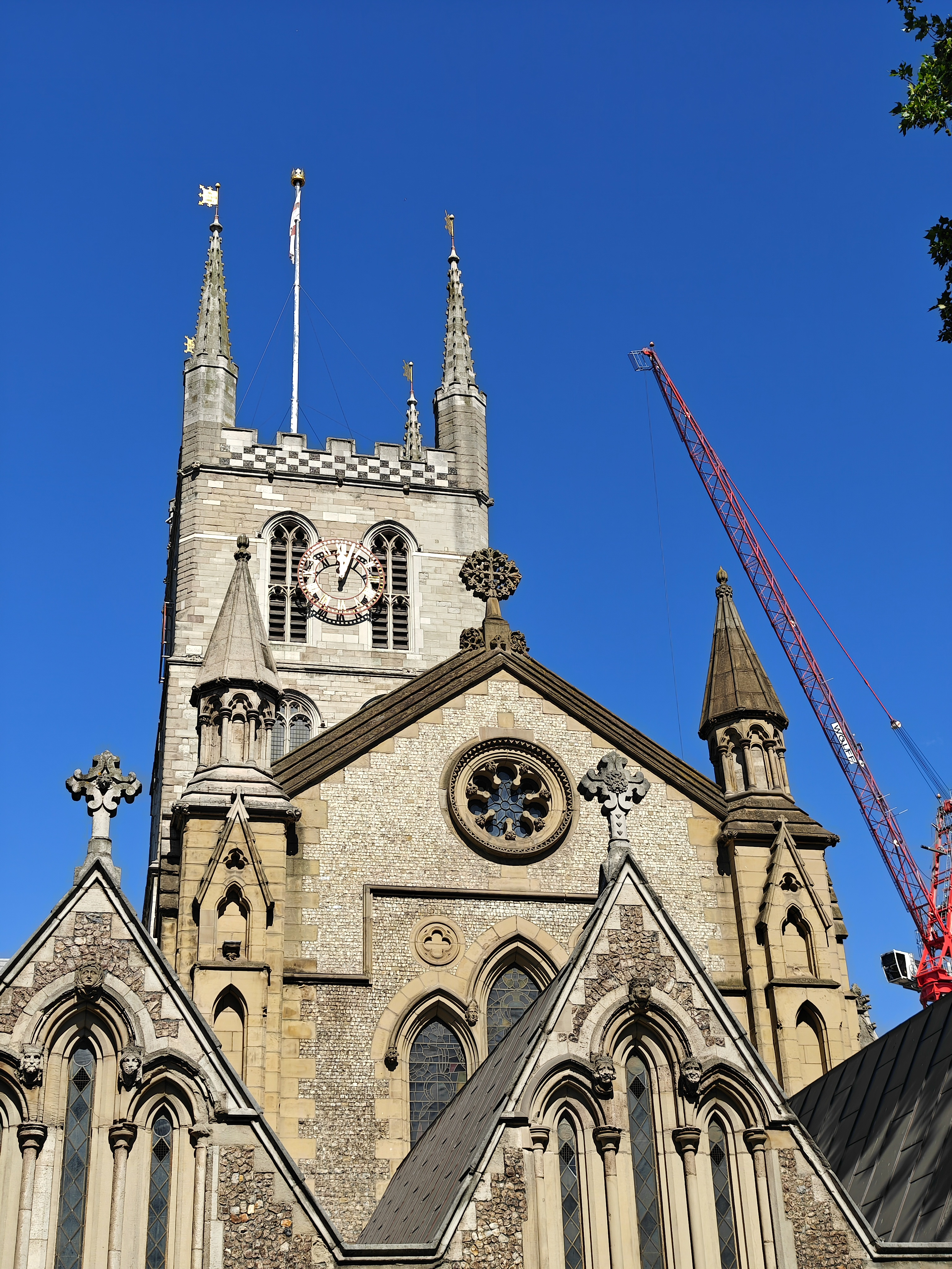 Church spires rising in front of a blue sky