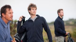 Three men wearing fleeces