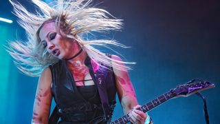 Nita Strauss performs with Alice Coopers on stage at Resorts World Arena on May 30, 2022 in Birmingham, England.