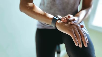 Person checks the time on their watch