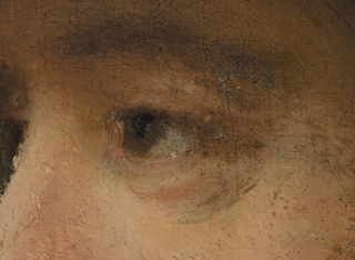 A close up of an eye in the painting