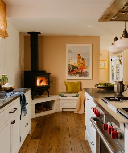 kitchen with fire in the corner and white cabinets
