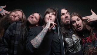 The members of Suicide SIlence pulling faces at the camera
