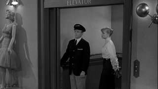 Marsha and elevator man inside elevator in The Twilight Zone'"The After Hours"