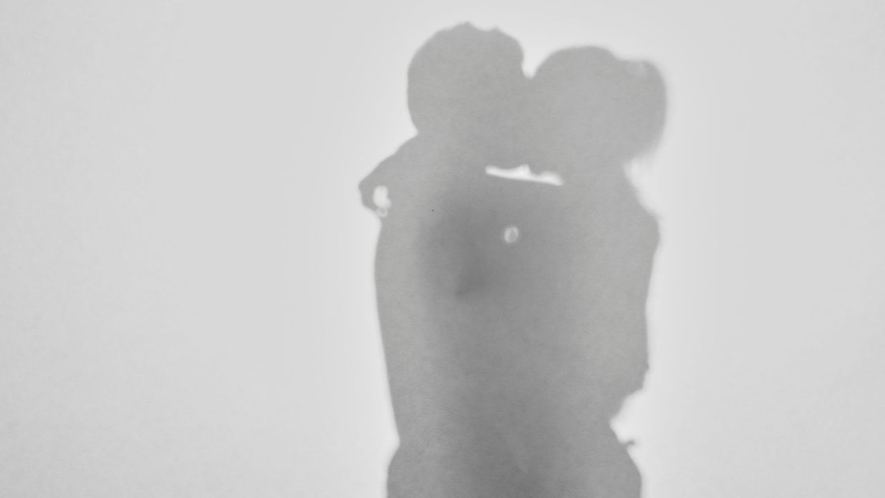 Hot sex position: A silhouette of a couple kissing