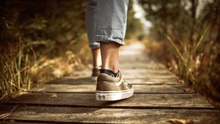 how to lower blood sugar: person walking best walking shoe