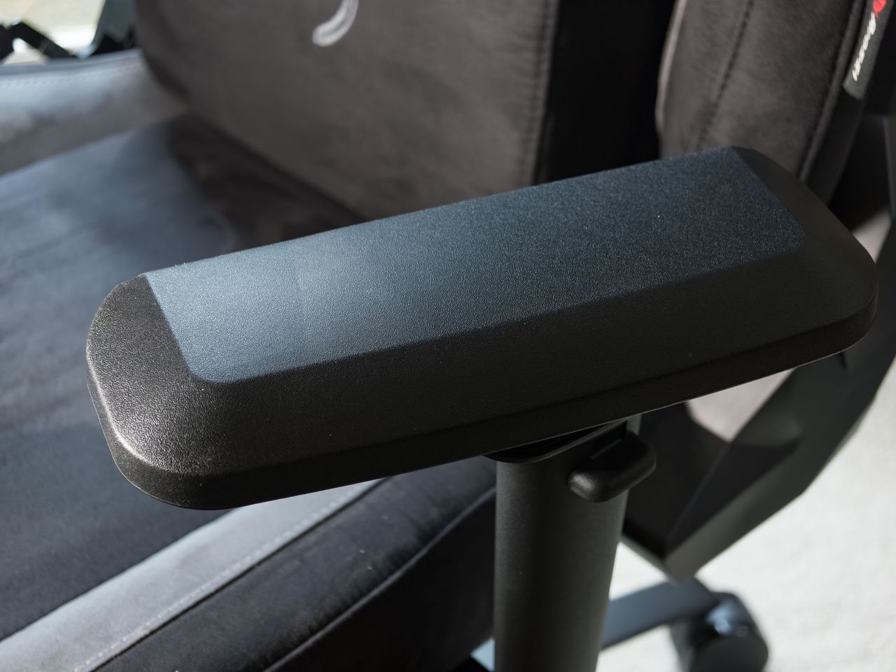 Closeup of the Arozzi Vernazza Supersoft gaming chair's arm rest, turned inwards