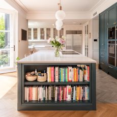 Kitchen with island with bookshelf built in