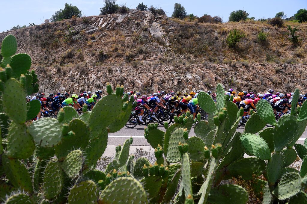 TORTOLI ITALY JULY 01 A general view of the peloton passing through a landscape during the 33rd Giro dItalia Donne 2022 Stage 2 a 1065km stage from Villasimius to Tortoli GiroDonne UCIWWT on July 01 2022 in Tortoli Italy Photo by Dario BelingheriGetty Images