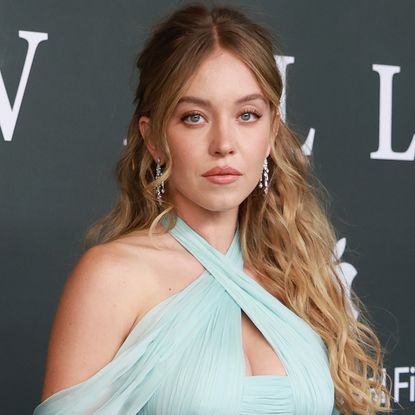 Sydney Sweeney attends the 'Echo Valley' premiere in a blue Miu Miu gown.