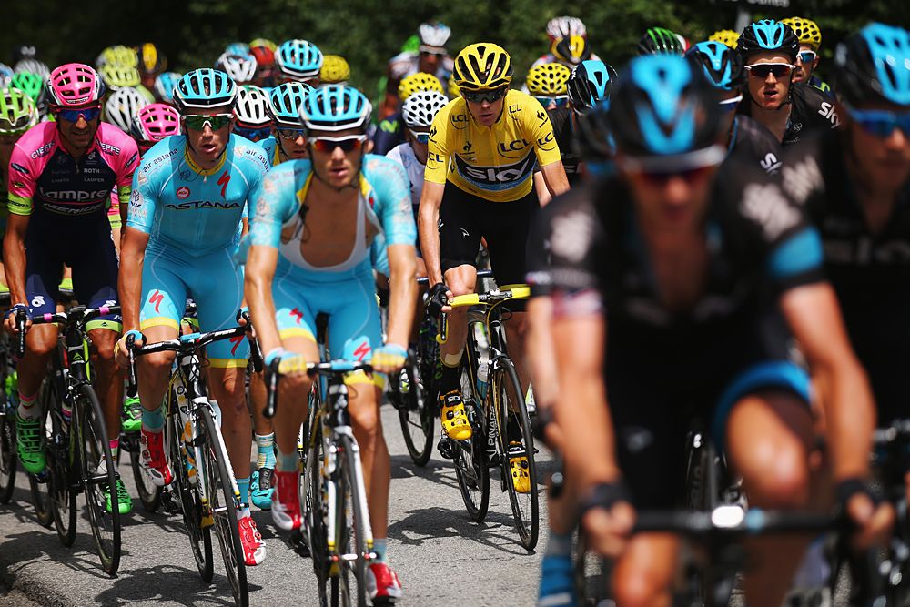 Chris Froome (Team Sky) sits in the field protected