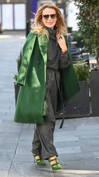 Amanda Holden wearing emerald green coat, handbag and shoes on March 18, 2025 in London