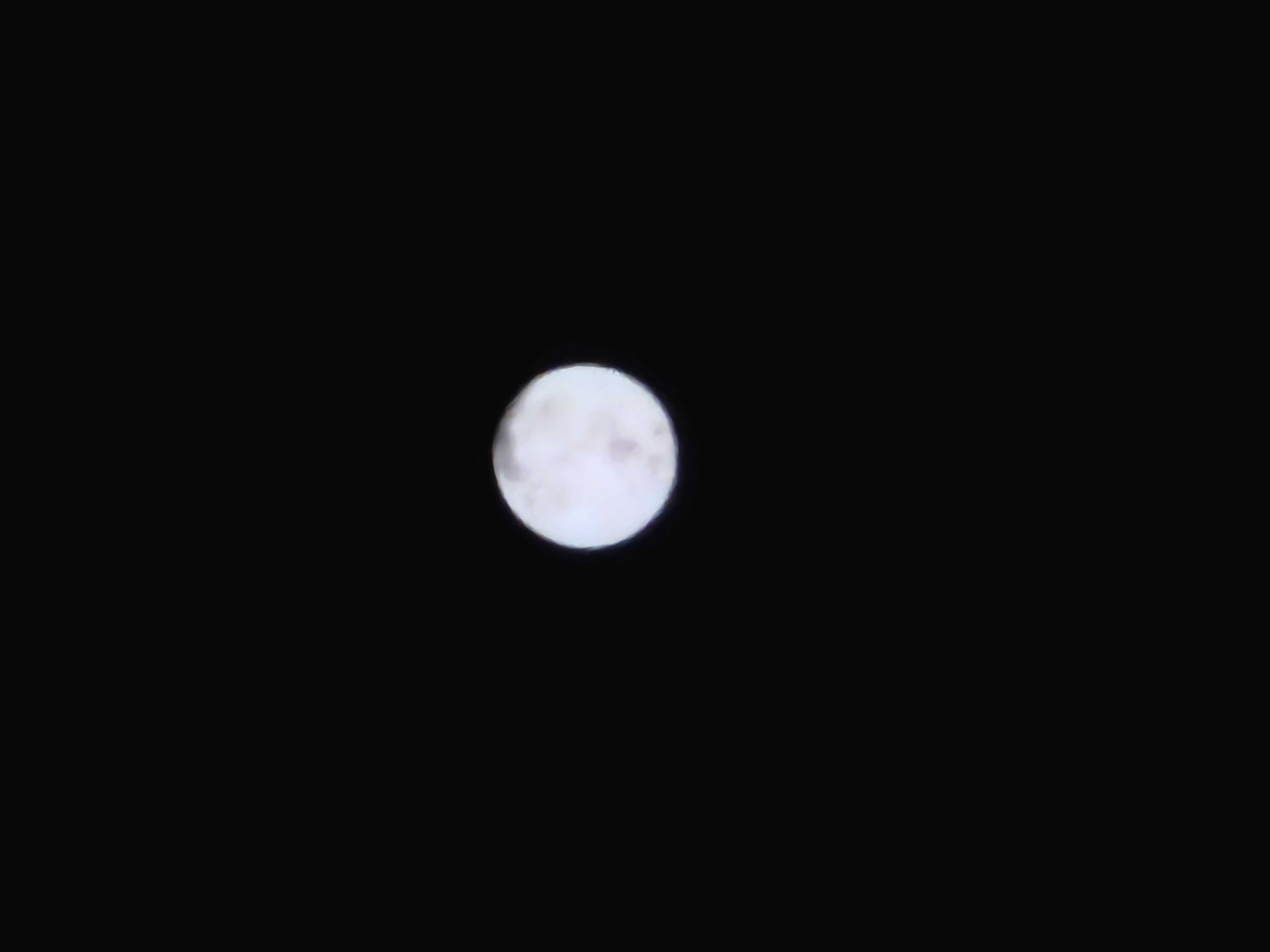 A photo of an artificially blurred image of a moon taken on the Galaxy S23 Ultra at 30x magnification, designed to prove whether or not Samsung's photo processing is "faking" the image