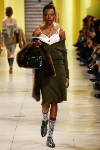 a model walks the Miu Miu fall/winter 2025 runway