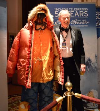 Jim Whittaker, the first American to climb to the top of Mount Everest, poses with the gear he wore on that expedition at the 2013 Explorers Club dinner.