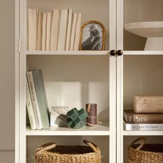 Three geometric objects on a bookshelf