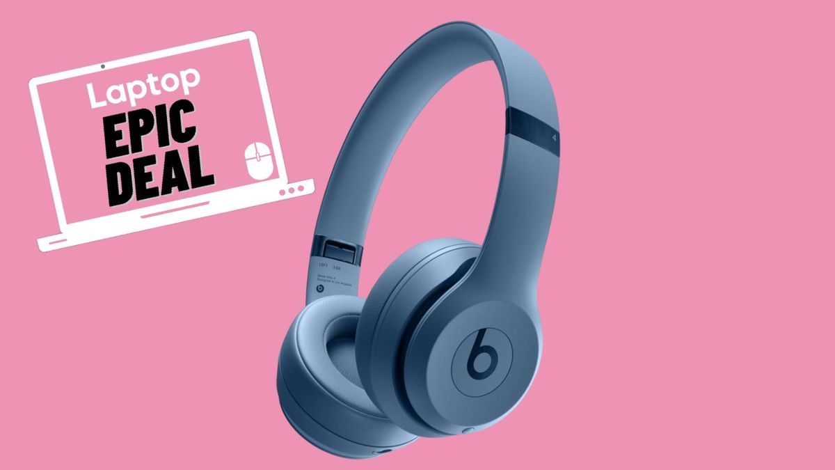 Blue Beats Solo 4 headphones against pink background