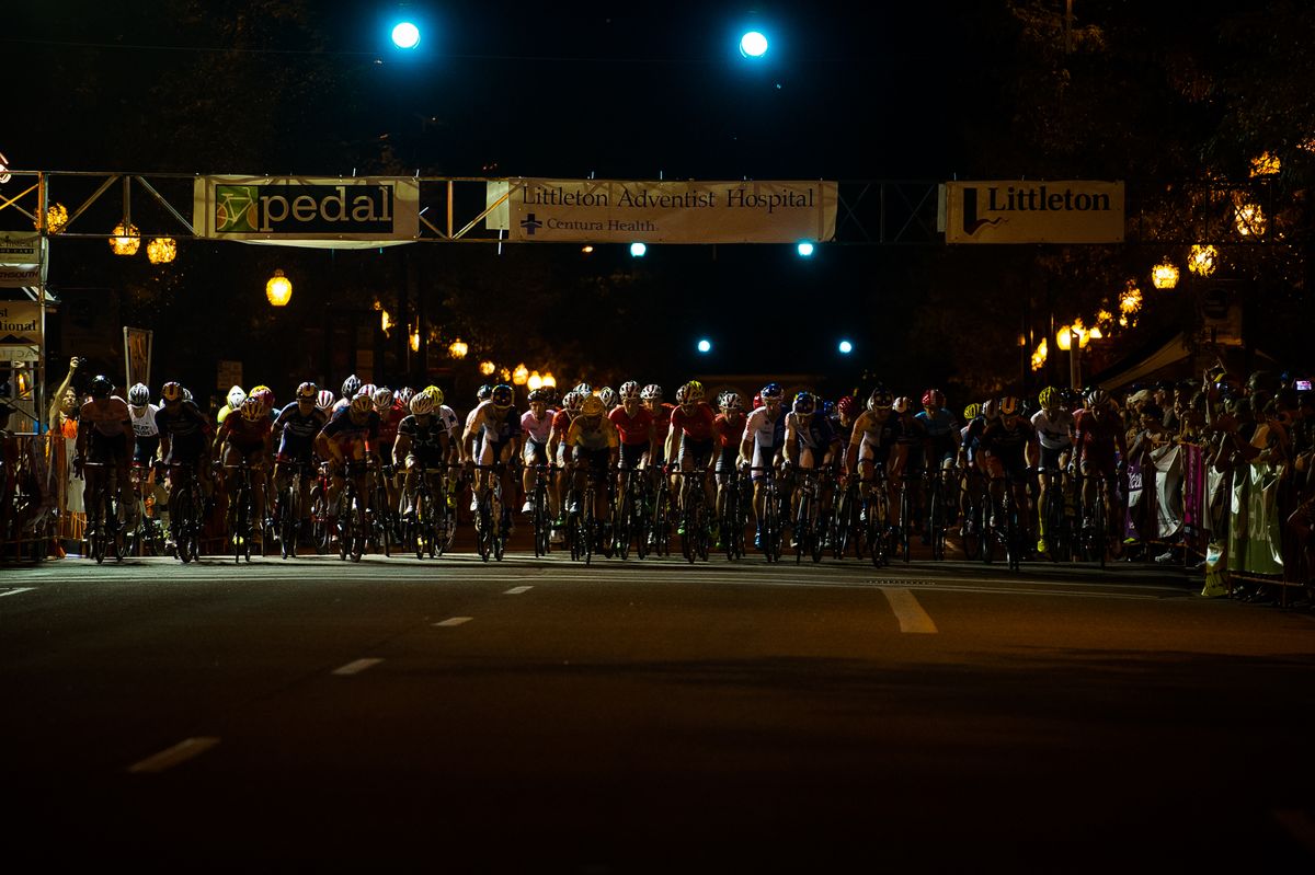 The start of the men's race through the darkened streets, with a smattering of light, of Littleton, Colorado.