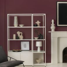 Cherry mocha painted wall with white shelving unit