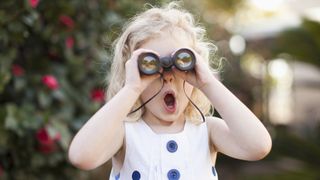 reasons you need binoculars: child enthused by binoculars