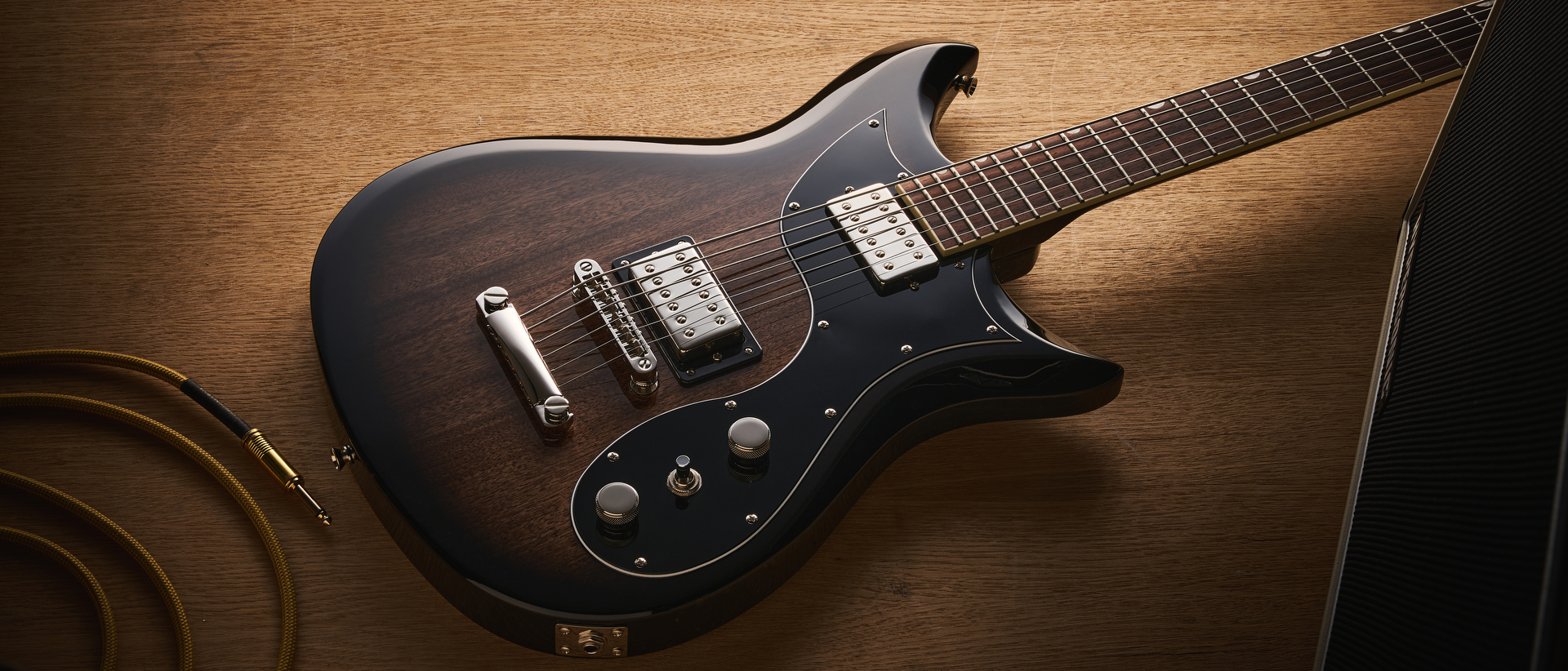 Gretsch Electromatic CVT Baritone in Bristol Fog brown sunburst finish shot on wood.