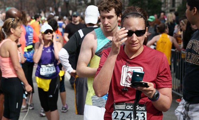 Runners react near Kenmore Square after two bombs exploded during the 117th Boston Marathon, April 15.