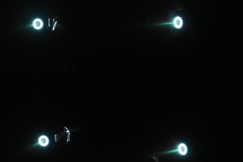 four white rings on a black background