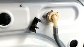 Grey water pipe connection on back of washing machine
