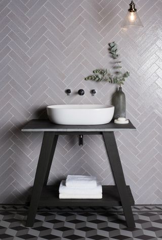 freestanding bathroom sink with unit and wall-mounted taps