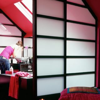 attic room with pink wall and japanese sliding door