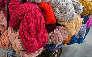 A trolley carries skeins of different coloured yarns for carpet-making, in the Kidderminster Museum of Carpet