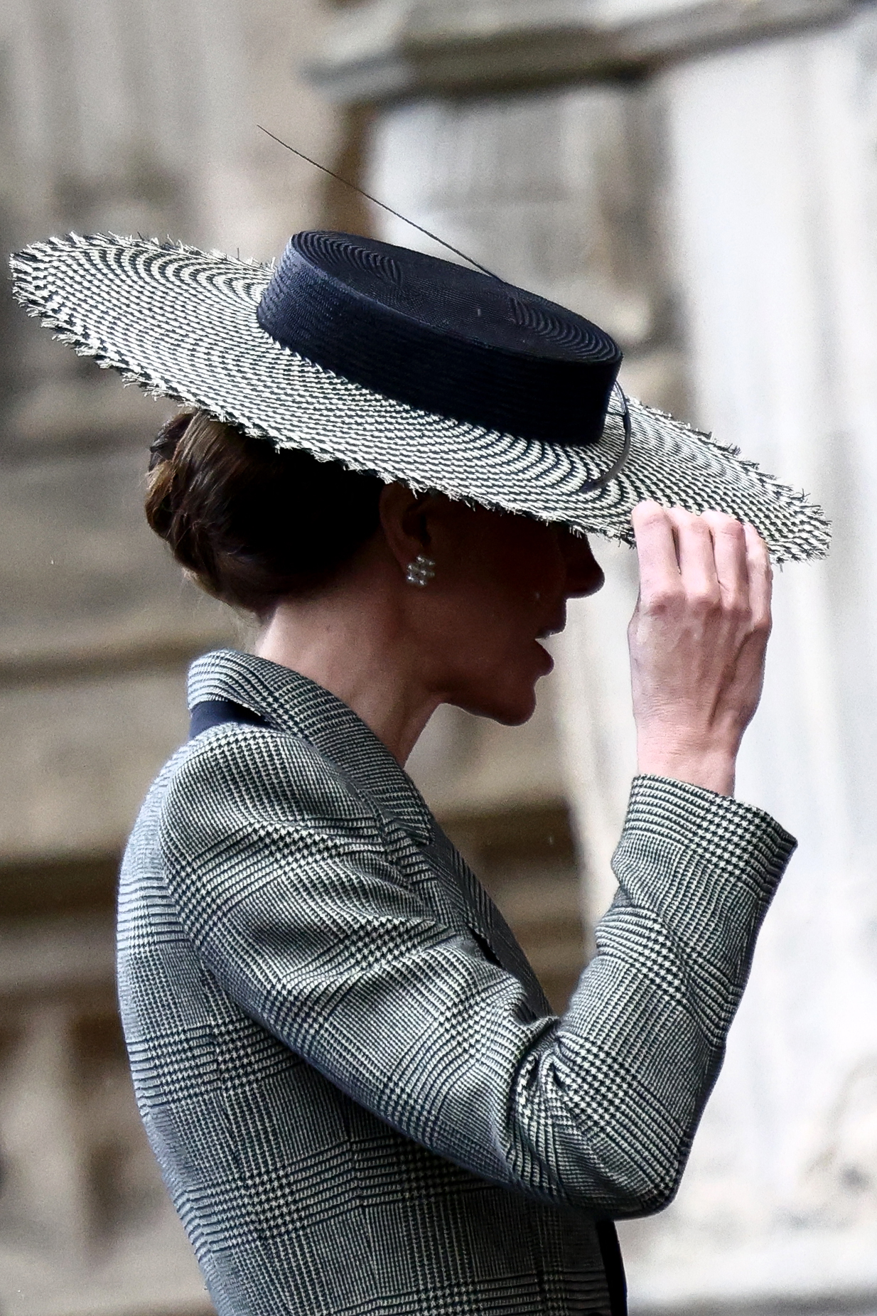 Britain's Catherine, Princess of Wales arrives to attend the installation ceremony of Archbishop of Canterbury Sarah Mullally at Canterbury Cathedral, south-east England on March 25, 2026. The Church of England became Britain's state establishment church following King Henry VIII's split from the Roman Catholic Church in the 1530s. The British monarch is its supreme governor, while the Archbishop of Canterbury is seen as the spiritual leader of Anglicans worldwide. (Photo by Henry NICHOLLS / AFP)