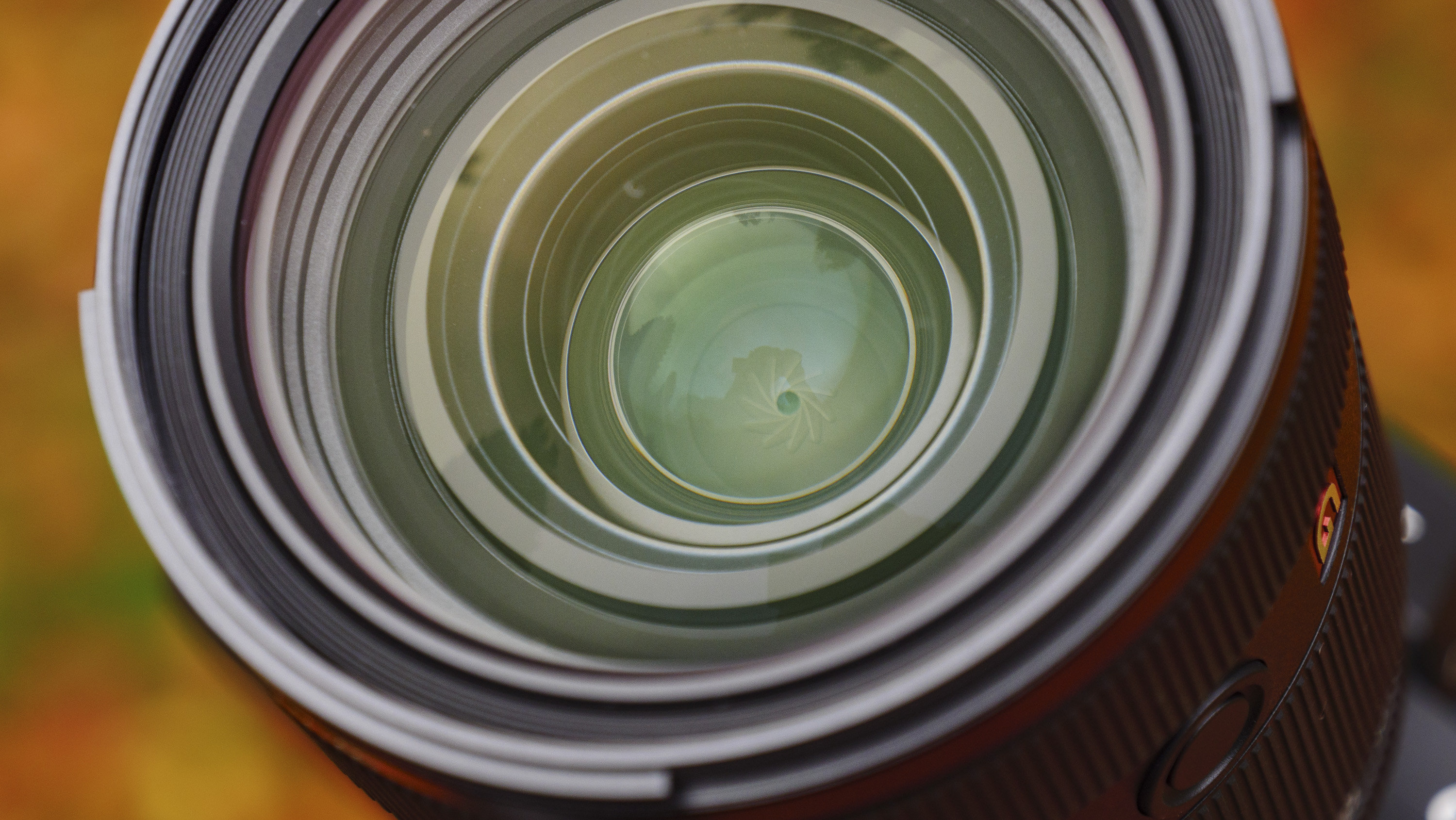 Closeup of the Sony FE 28-70mm F2 GM lens's front lens element