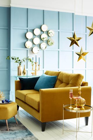living room with yellow sofa by DFS