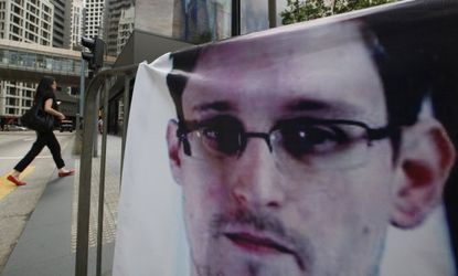 A banner supporting Edward Snowden is displayed in Hong Kong's business district, June 20.