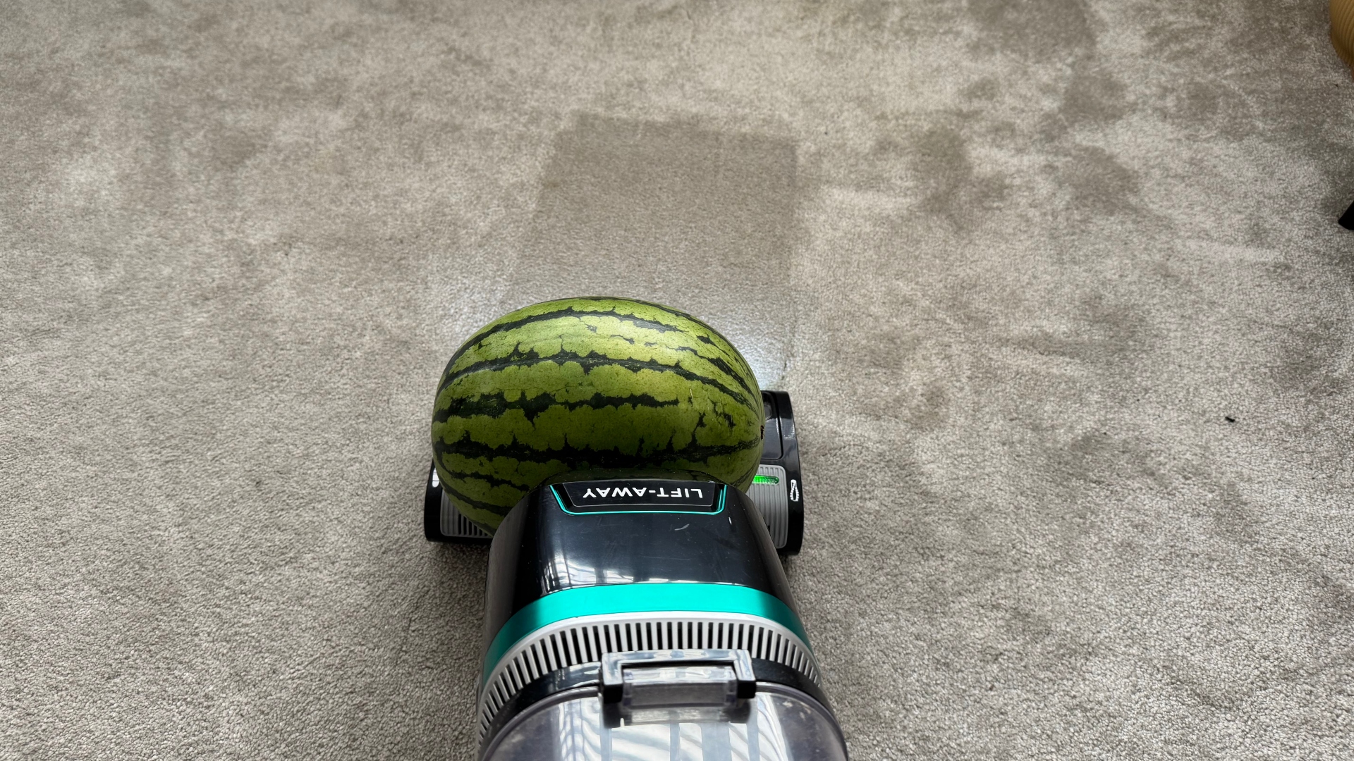 A watermelon hoovering on a vacuum