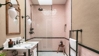 pink tiled shower room with screen